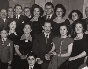 Nathan and Helen Offen at their engagement party in London, 1950 (third and fourth from left). Nathan's brothers Sam and Bernard are in the top row, second and third from left. Photo courtesy of Stephen Freedman. 