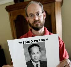 Jay Winuk, co-founder of 9/11 Day, with a missing person's flier of his brother, Glenn Winuk, a firefighter who died in 2001. Courtesy of Jay Winuk 