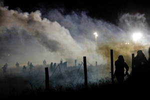 Police near Cannon Ball, N.D., fired tear gas Nov. 20 at protesters opposed to plans that would run the Dakota Access pipeline near the Standing Rock Indian Reservation. Stephanie Keith/ Reuters 